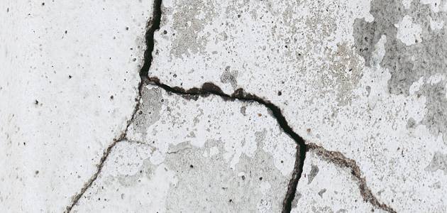 a close-up of a crack in a concrete floor