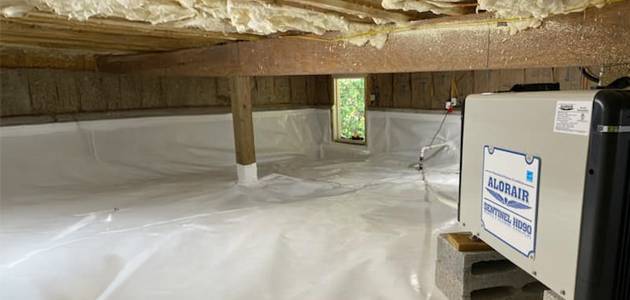 a basement with white plastic covering