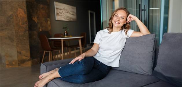 a woman sitting on a couch