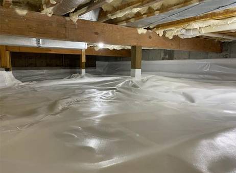 a basement with white foam covering the floor