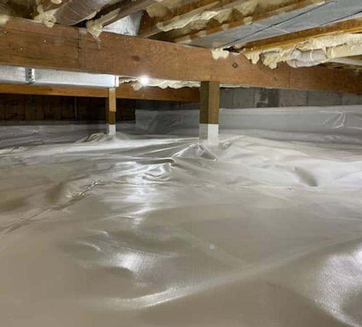 a basement with white plastic covering