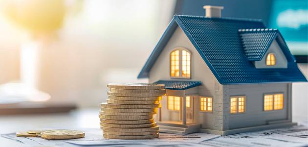 a small house with a stack of coins