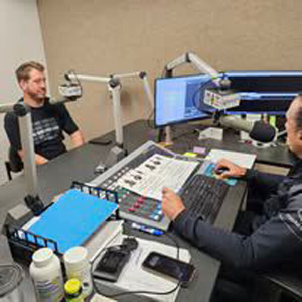 Two people in a radio studio