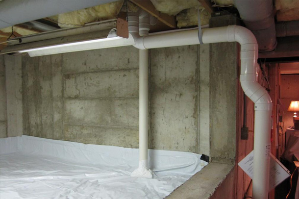 White pipes in a basement setting