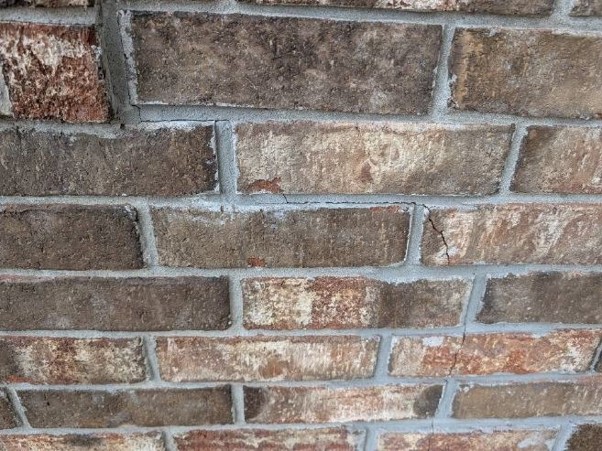 Brick wall with visible cracks