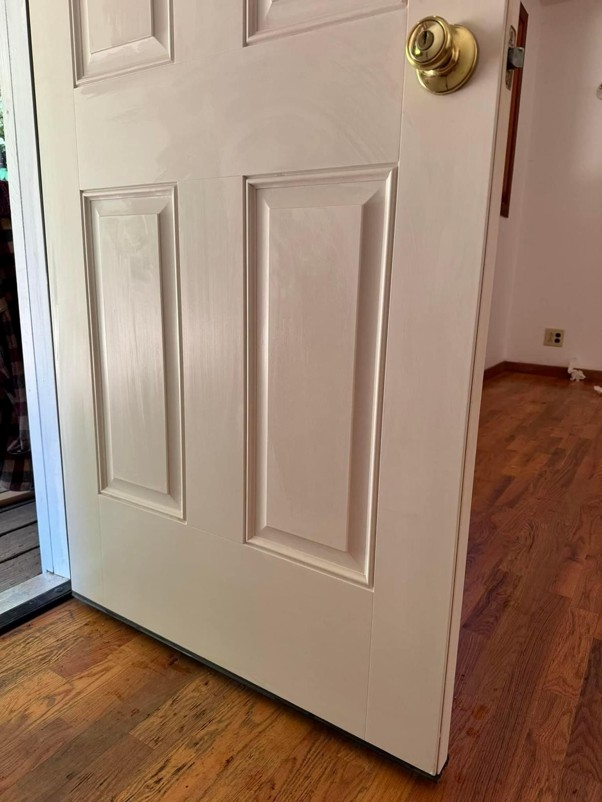 White door with brass doorknob.